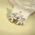 Arete flor doble tono